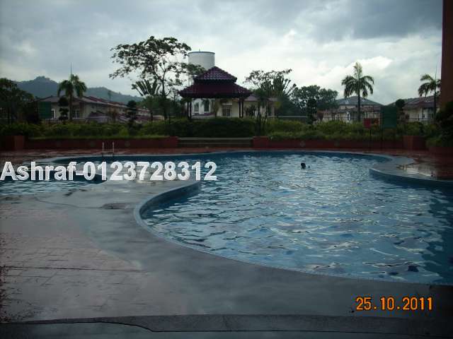 Pool at ground level and play area in background