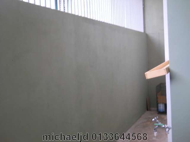 back of the house with high wall