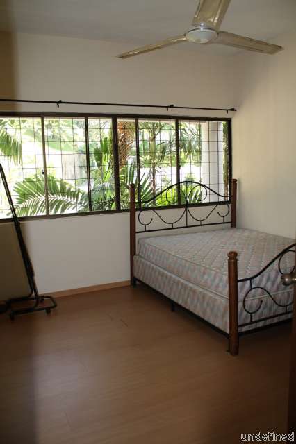 Bedroom with wooden flooring