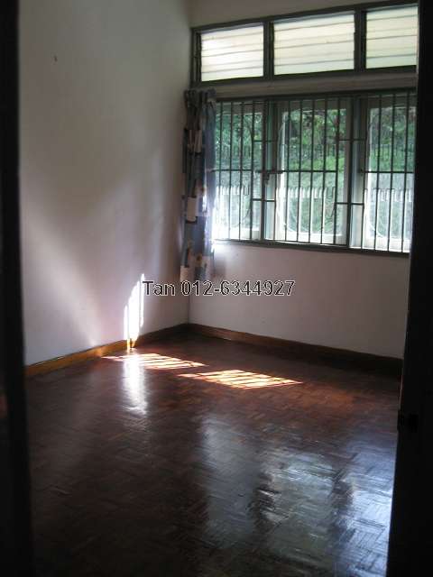 Second bedroom with view of trees